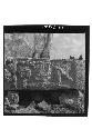 Sculptured lintel, close up of sculpture with glyphic stones in hilltop milpa.