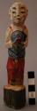 Figurine, carved wood, standing human, polychrome paint, holding object