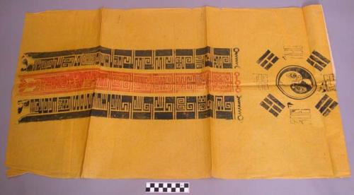 Print, red and black on yellow, with bah gua, character inscriptions, folded