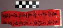 Print, black inscription on red paper, poetry form, wrinkled, torn