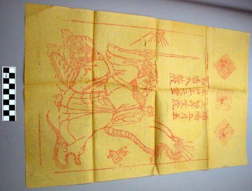 Print, red on yellow, figure riding tiger, with sword, surrounded by five poison