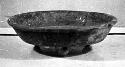 Ceramic tripod bowl, perforated legs, flared rim