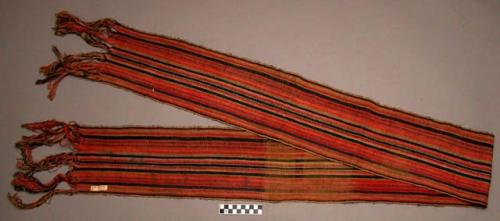 Woman's woven girdle with simple longitudinal stripes of faded red, +