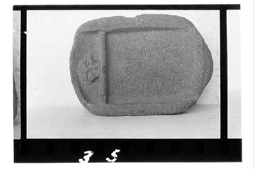 Four legged metate with animal head at one end