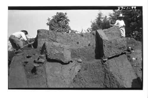 Men working on east side of pyramid 5; Mound A