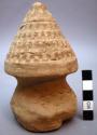 Figurine, moulded clay stupa, conical top with surrounding stupa motif