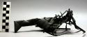 Black palm leaf bird. One of series (39-17-70/1402-1419) strung on rattan +