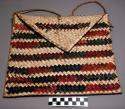 Basketry envelope bag with string handle. Decorated with red and black +