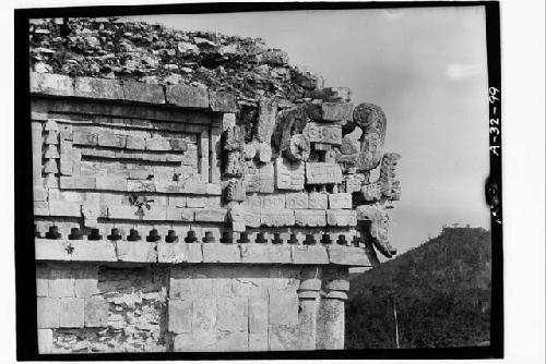 Detail of mask on corner, Structure 1; East wing; Southwest corner