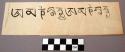 Print, black on white, Om Mane Padme Hung in Tibetan, written twice