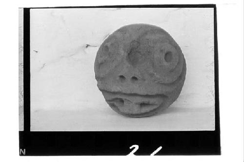 Solid head of brown clay. Cut off square at back of heads from Uxmal in MA1