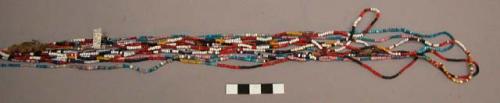 Multi-colored glass bead necklace, worn by women during the child- +