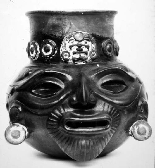 Large rattle jar representing human head.  Plumbate black to red ware