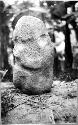 Sculptured stone human figure-front  view