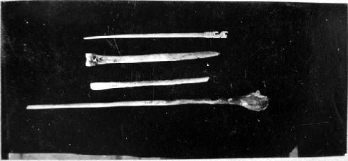 Carved bone implements from A-V.  Cat. Nos. 3502, 4065, 3741, 4000.