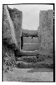 A-V: looking thru doorway in E. wall of Room 19. Lower steps were used in Period
