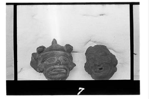 Pottery heads broken from jars  a. Black ware  b. Fine red ware