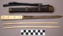 Chopsticks, squared handling end, toher end cylindrical and blunt