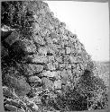 Terrace wall with plaster showing, West side of main pyramid - from Northwest.