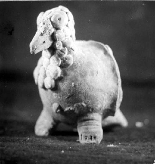 Ceramic figurine, bird, noded head and neck, broken