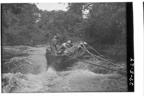 Boat going up rapids