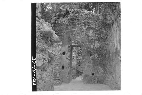 Looking south at the doorway in the south end of Room 3, Structure, B-XIII