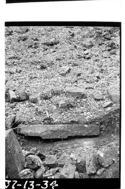 Long stone with hieroglyphics forming center of east bench, Ballcourt 3