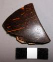 Fragment, polished coconut shell rim fragment