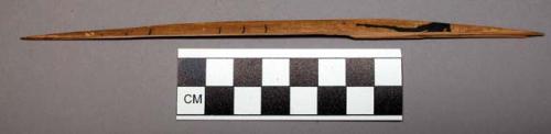 Reed fragment, traces of black pigment, linear designs