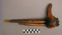 Musical instrument - pan pipe principle. 5 bamboo sticks set through the base of