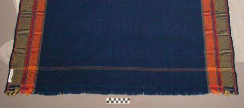 Textile; blue with lengthwise stripes.
