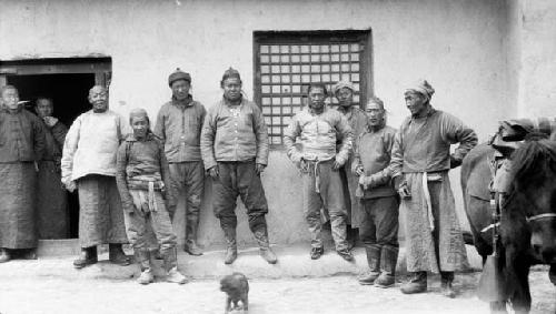 Group of men in front of building