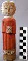 Figurine, carved wood, standing human, red robes, white face, abraded