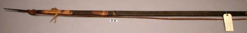Wooden fighting bow - string of cane; bands of black & tan basketry +
