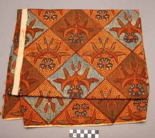 Batik cloth with geometric flower design, tan, yellow and blue, 5' 4" +