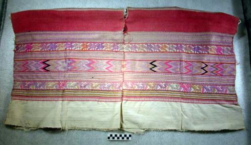 Huipil, white. white and red background with purple, yellow, pink, black, blue d