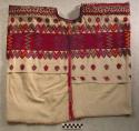 Huipil. white with bright red, green, yellow, and purple embroidery. 107 x 60 cm
