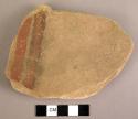 Sandstone fragment with red and black paint