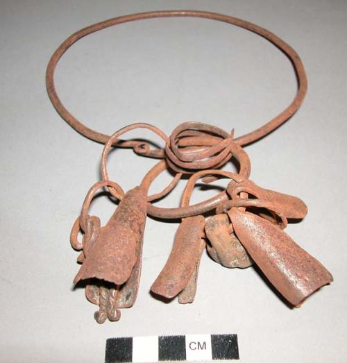 Iron necklet with iron bells, pendant, rings and nut