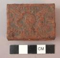 Half fragment (edge half) of iron celt in iron box - called "lai"