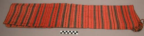 Red & black striped cloak of ramie cloth, worn over one shoulder by +