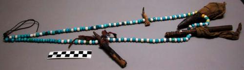 Ceremonial necklace of blue and white glass beads, small wooden +