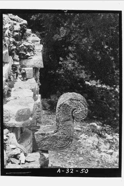 Nose of mask on west facade of East Wing, Str.1