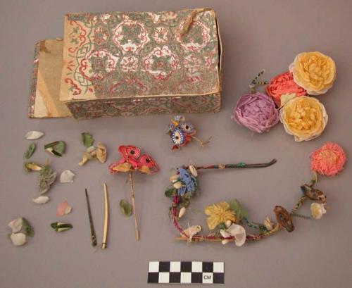 Paper flowers made into ornament for woman's hair