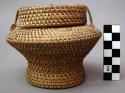 Basket, with lid, carinated body, pedestal base, wrapped loop closures