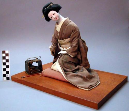 Courtesan doll with tea stove