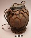 Coconut shell container for cooked meat for children