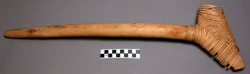 Wooden handled ax, used for chopping trees; also for injuring women. 20" L. hand