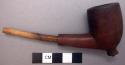 Carved wooden pipe with stem, length: 12 cm.