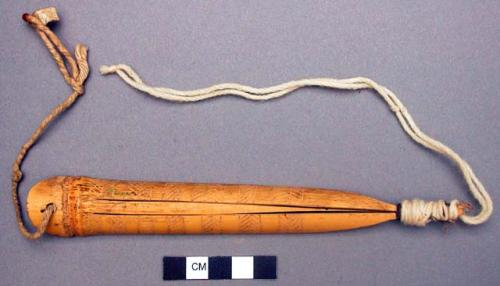 Mouth harp with incised decorations of herring-bone motifs.